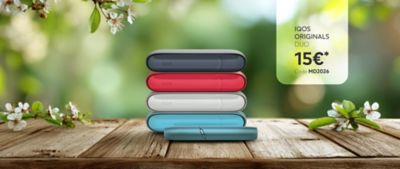 IQOS ORIGINALS DUO vor frühlingshaftem Hintergrund. 