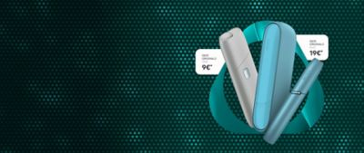 Zwei IQOS ORIGINALS Geräte vor dunkelgrünem Punktemuster.