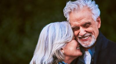 Woman with a golden IQOS holder and charger in her hand