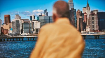 Woman with a golden IQOS holder and charger in her hand
