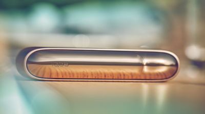  IQOS holder, charger and other accessories on a table