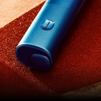 blue BONDS 2 by IQOS device on a wooden table