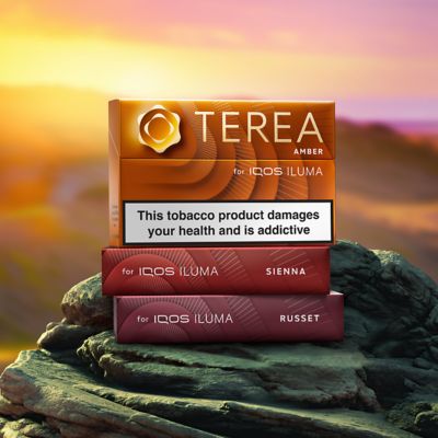 TEREA packs standing on a sunset background, the packs include Amber, Russet, Sienna
