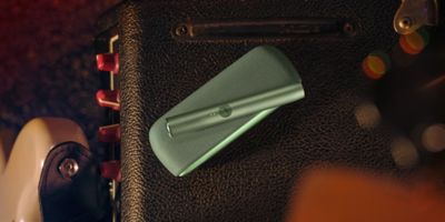 Woman holding IQOS device