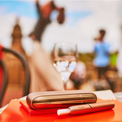 An IQOS device on a table. 