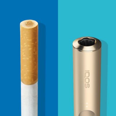 Filtro de cigarrillo con manchas marrones de combustión comparado con una unidad de tabaco TEREA en un IQOS ILUMA holder sin ninguna mancha equivalente.