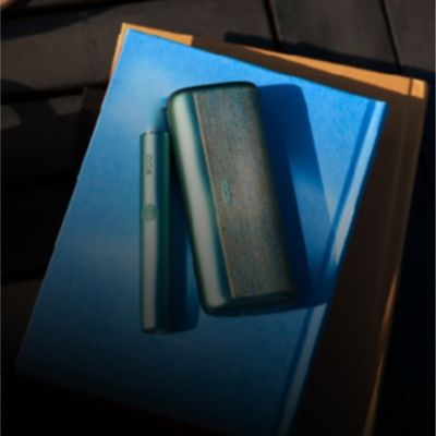 Zelená IQOS ILUMA  prime zariadenie.