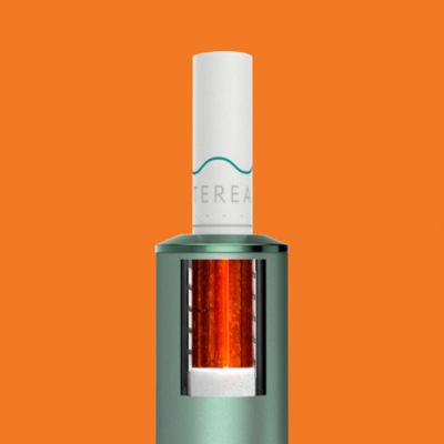 A Moss Green IQOS ILUMA with a TEREA stick inserted.