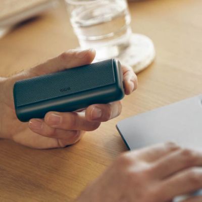 Brilliant gold IQOS 3 DUO on top of charger