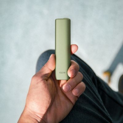 Two people with mobile phones having coffee.