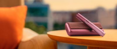 Young man opens his IQOS gift box