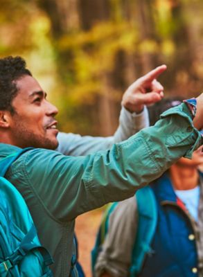 Man with a gold IQOS Duo and a mobile in his hands