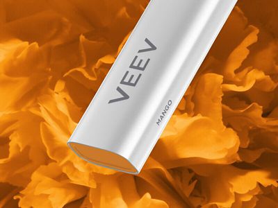 Close up of the bottom part of the VEEV NOW peach vape device on an orange patterned background