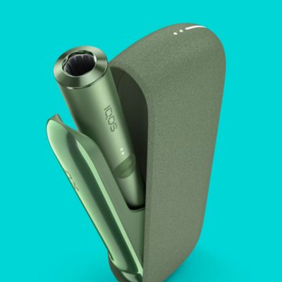 An IQOS ILUMA device, with Pocket Charger and Holder.