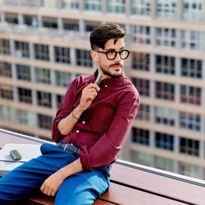 Woman holding IQOS device