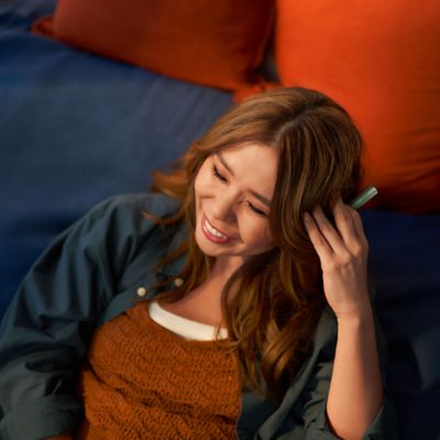 Two friends holding IQOS devices