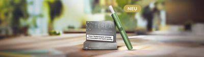 Zwei TEREA Silver Packungen mit einem IQOS ILUMA Holder