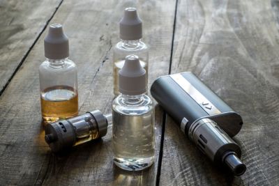 vape and e-liquid on a table