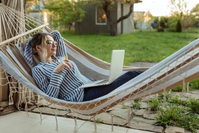 Person vaping on a hot day in a hammock