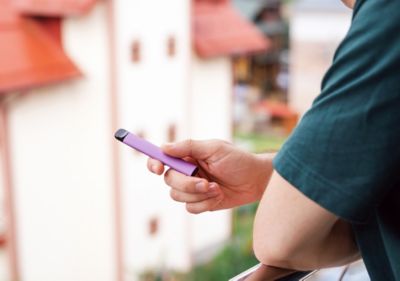 man holding disposable vape
