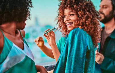 Friends enjoying IQOS devices.