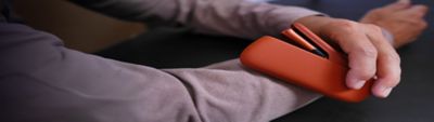 A person opens an IQOS gift box