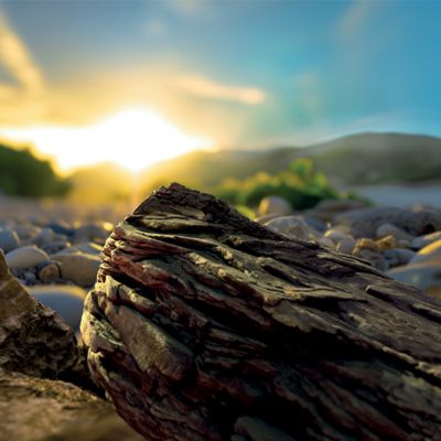 Krabička TEREA Yellow na pozadí krajiny při západu slunce