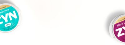 Dvě uzavřené krabičky ZYN (modrá Cool Mint a červená Black Cherry), pohled shora na polovinu krabičky