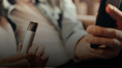 man holing phone and veev device