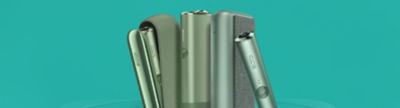 An IQOS ILUMA device, an IQOS ILUMA ONE, and an IQOS ILUMA PRIME device.